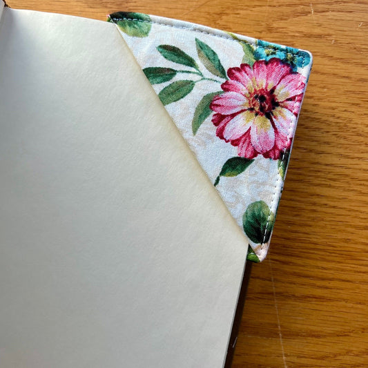 Eclectic Spruce corner bookmark placed inside of a book.