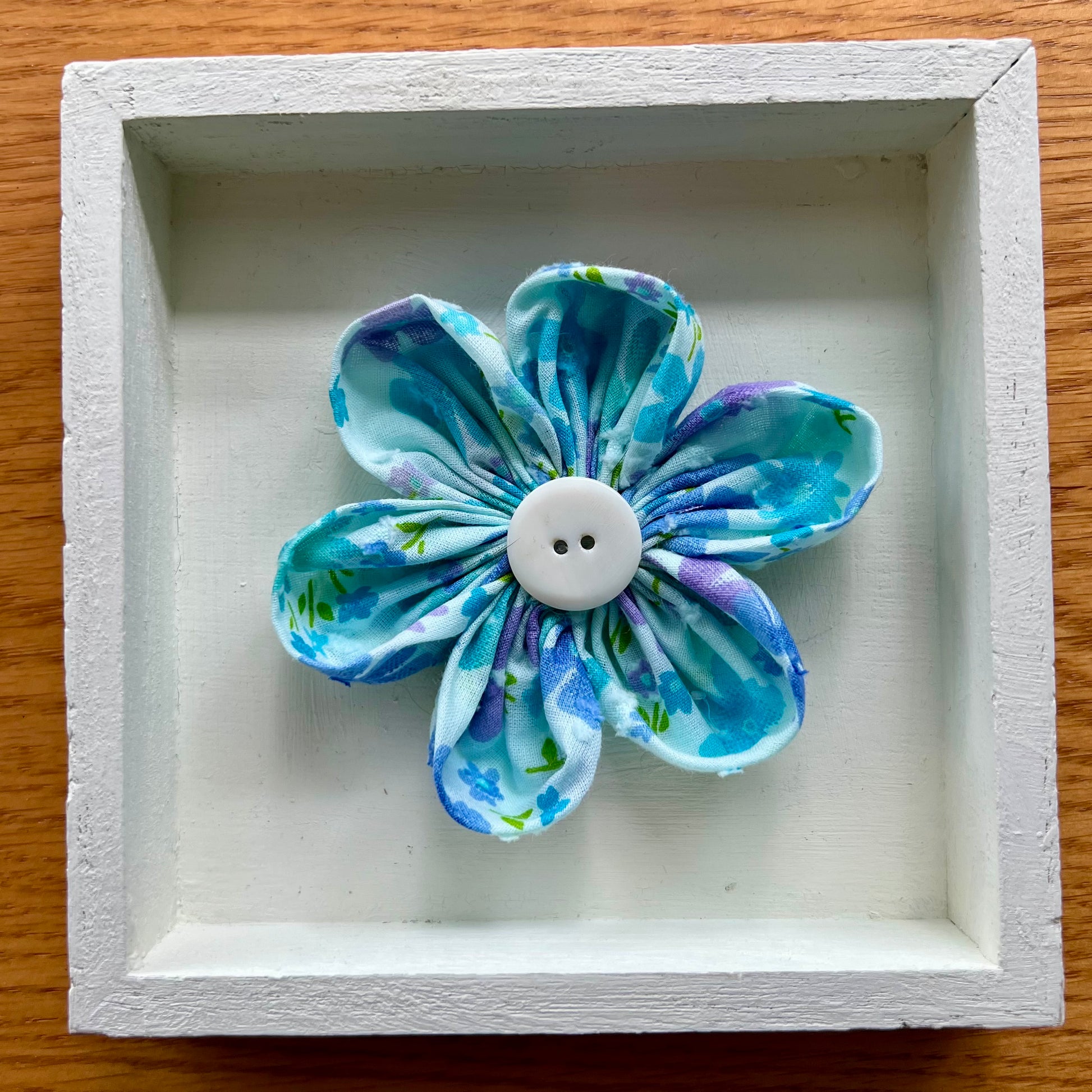 Hand painted 5x5x1" Mini Meadow wooden shadow box featuring hand-sewn 3D textile flower made with reclaimed fabric.