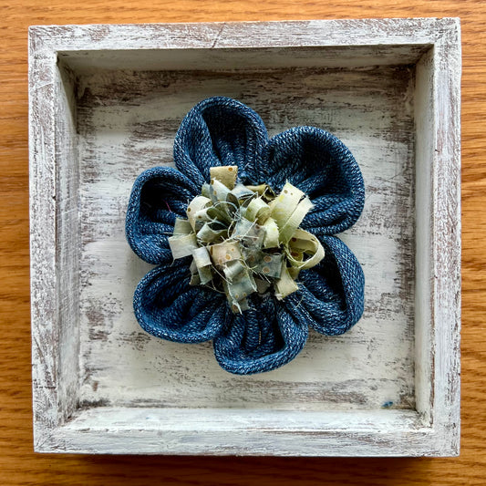 Hand painted 5x5x1" Eclectic Spruce Mini Meadow wooden shadow box featuring hand-sewn 3D textile flower made with reclaimed fabric. It features a center accent such as button, twine, and/or fabric fringe.