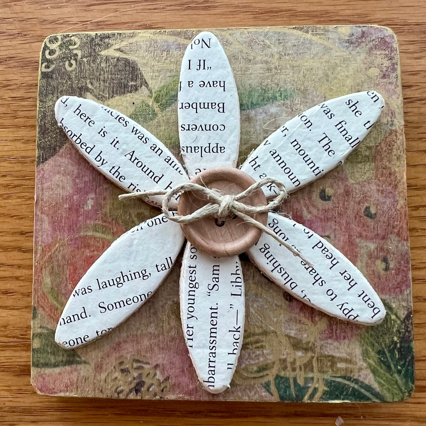 Literary Bloom magnet: Wood magnet art featuring 3D accents, repurposed book pages, and a floral background.
