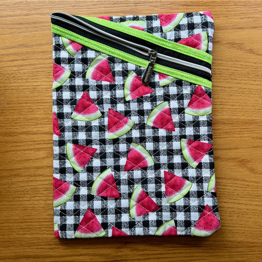 Eclectic Spruce large quilted zipper pouch featuring a fabric that has watermelon slices over a black and white buffalo check pattern.