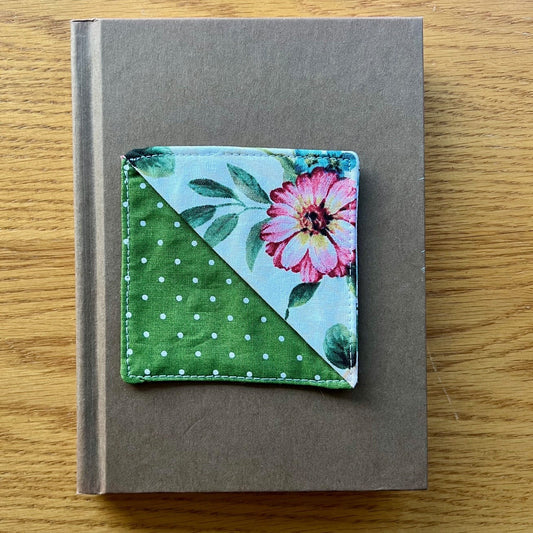 Eclectic Spruce corner bookmark sitting on top of a book.